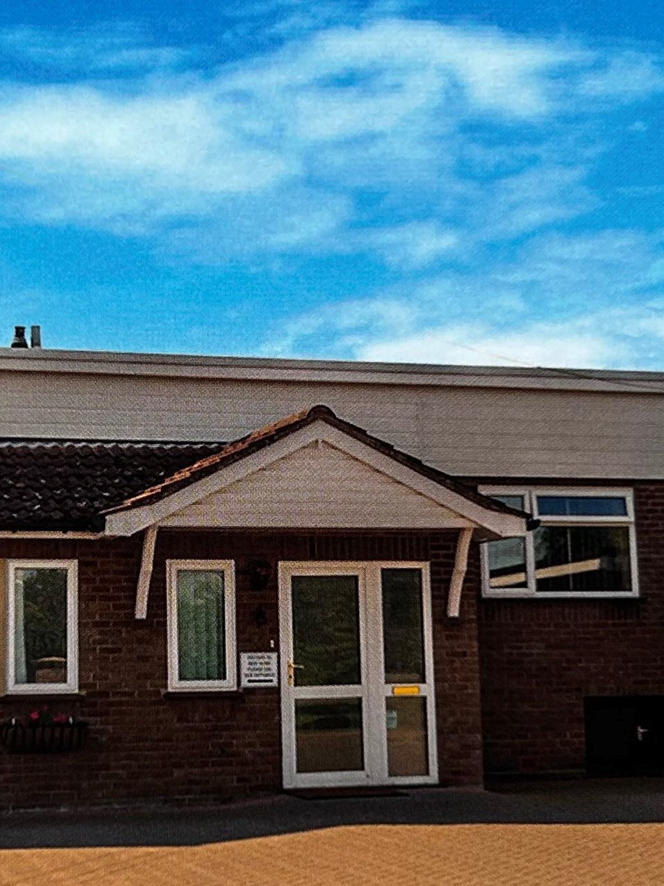 The front entrance of Stronvar Rest Home on Church Road, Brightlingsea, with window boxes in bloom